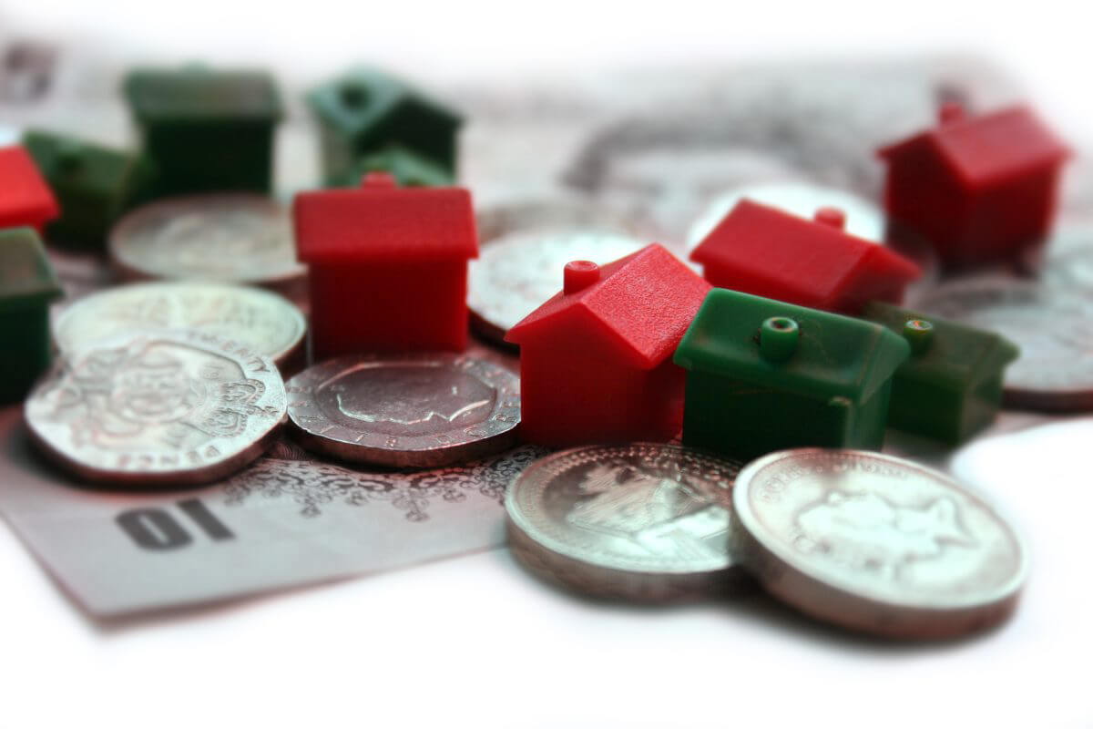 coins and mini toy houses