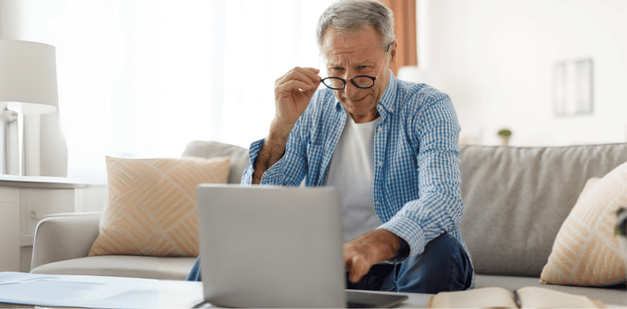 Trust Review Service, man looking at computer making a decision