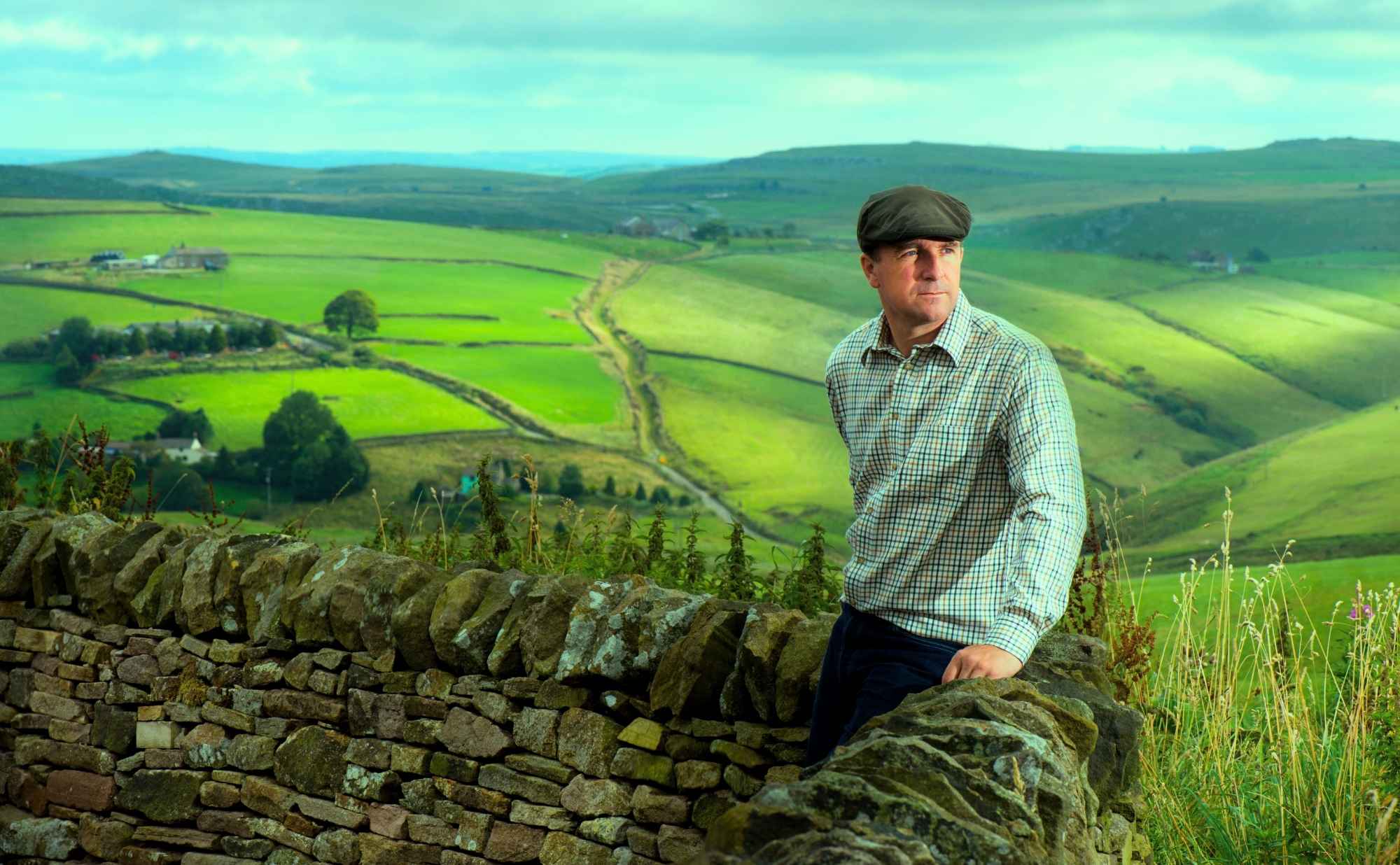 Farmer looking at his land