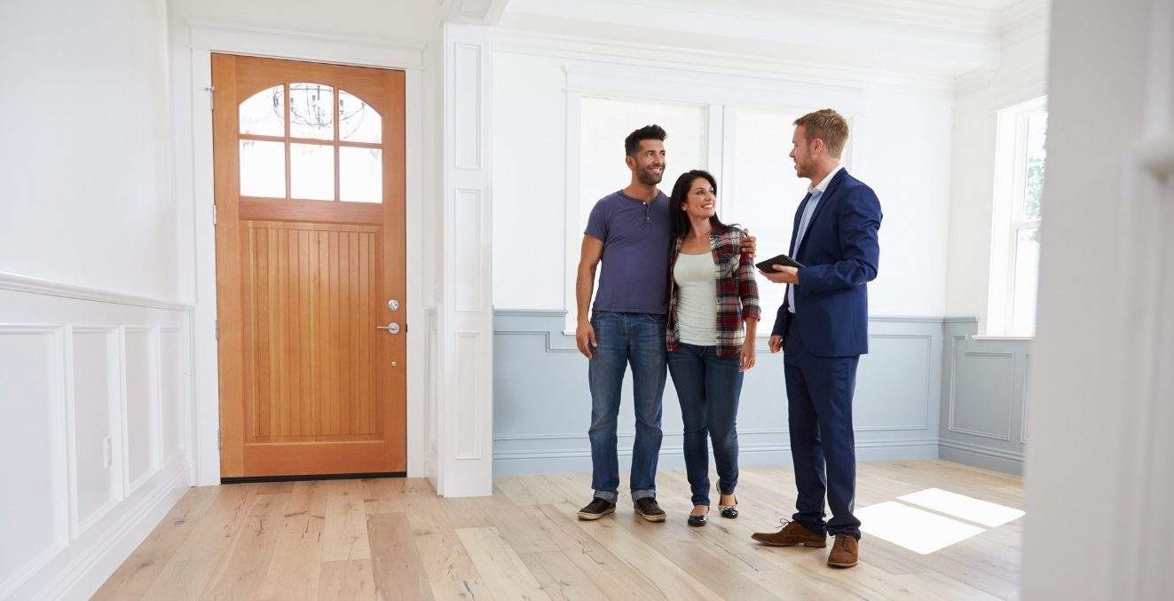 Landlord with tenants viewing house, Renters Rights Act